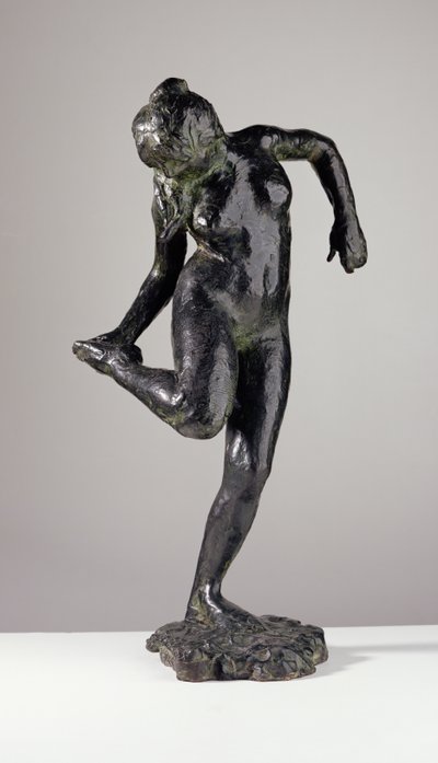 Dancer looking at the sole of her right foot by Edgar Degas